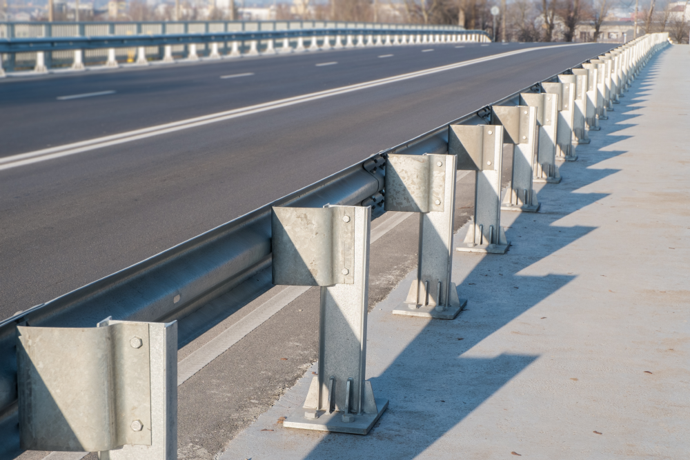 Highway bridge safety barrier installation